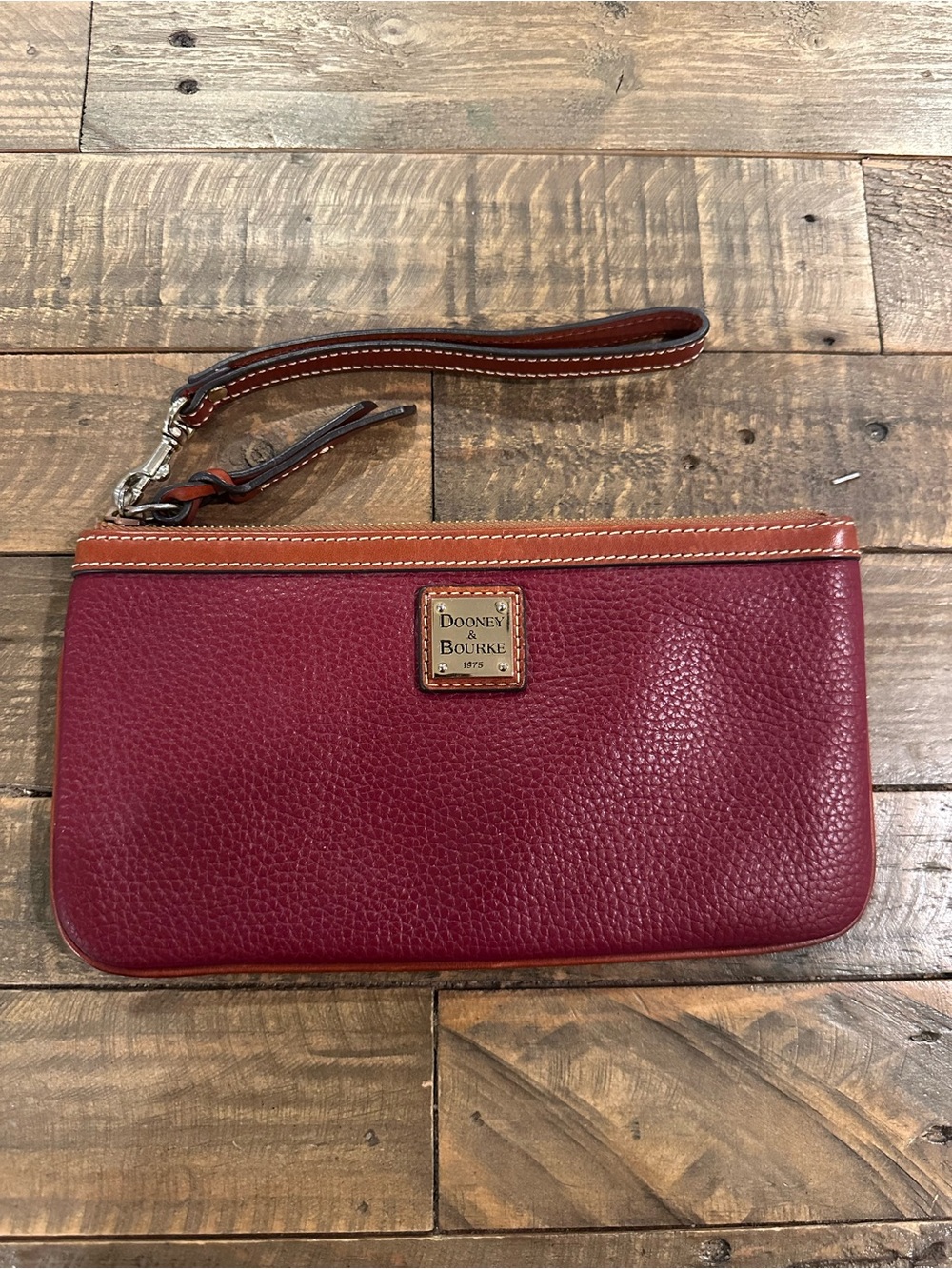 Dooney & Bourke Pebble Grain Leather Large Wristlet in Bordeaux